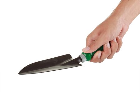 Hand holding garden trowel on white backgroundの写真素材