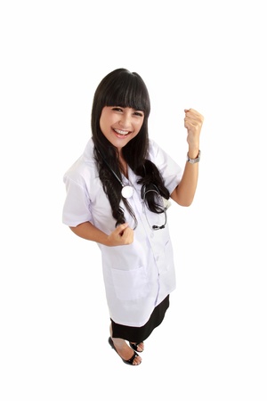 Nurse happy excited and joyful. Young woman nurse or doctor cheerful and joyful isolated in full length on white background.の写真素材