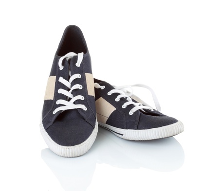 Classic black sneakers isolated on white backgroundの写真素材