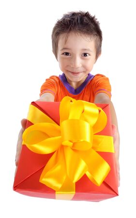 Little boy holding present box isolated on whiteの写真素材