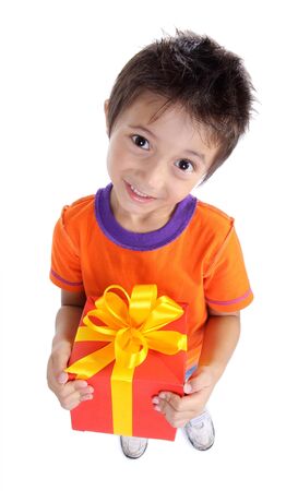 Little boy holding present box isolated on whiteの写真素材