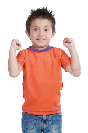 Portrait of a happy little young boy standing with over white backgroundの写真素材