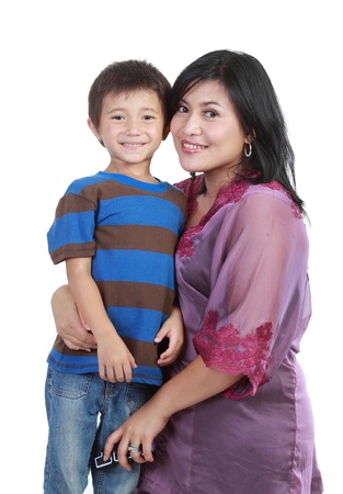 Portrait of a beautiful happy mother with smiling boy isolated on whiteの写真素材