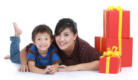 mom and kid with a stack of gift. isolated over white backgroundの写真素材