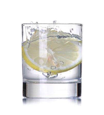 lemon splashing in water isolated on white backgroundの写真素材