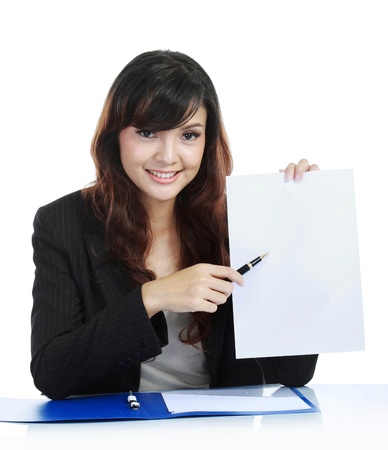 Young businesswoman showing clipboard, isolated on whiteの写真素材
