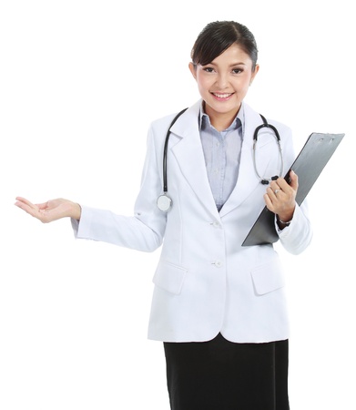 Young medical doctor woman presenting copy space for product or text. isolated on white background.の写真素材