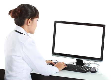medical doctor woman working with computer. Isolated over white backgroundの写真素材