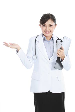 Young medical doctor woman presenting copy space for product or text. isolated on white background.の写真素材