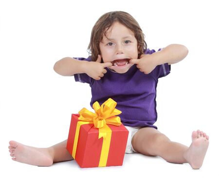 Joyful boy with present box . Isolated on white backgroundの写真素材