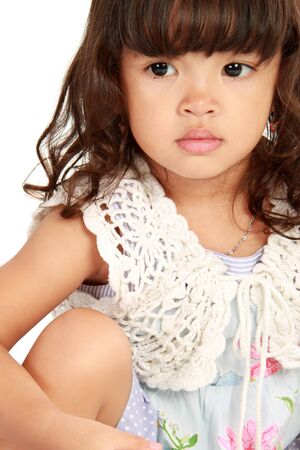 Portrait of happy smiling little girl on white backgroundの写真素材