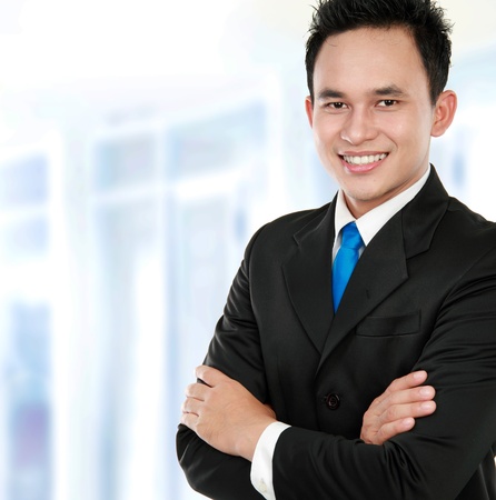 Portrait of a successful business man in the officeの写真素材