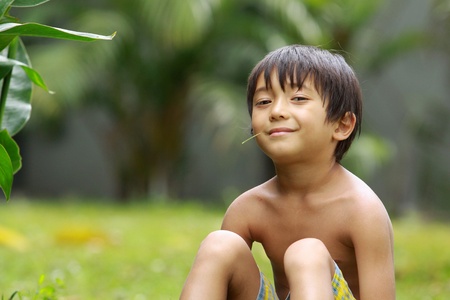 happy joyful boy relaxing in the summer dayの写真素材