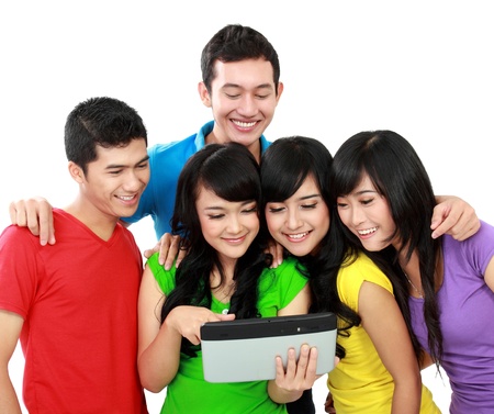 Group of Teenager Friends, one of them hold tablet pcの写真素材