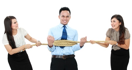 business man executive tied by his woman employeeの写真素材