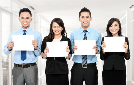business team holding small blank paper in the office