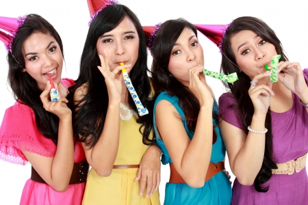 four young beautiful girls celebrate birthday isolated over white backgroundの写真素材