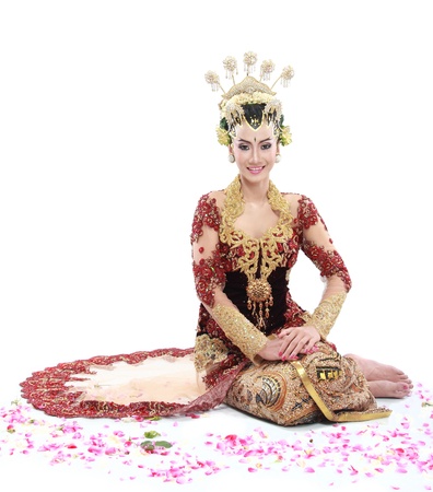woman traditional wedding dress of java. isolated over white backgroundの写真素材