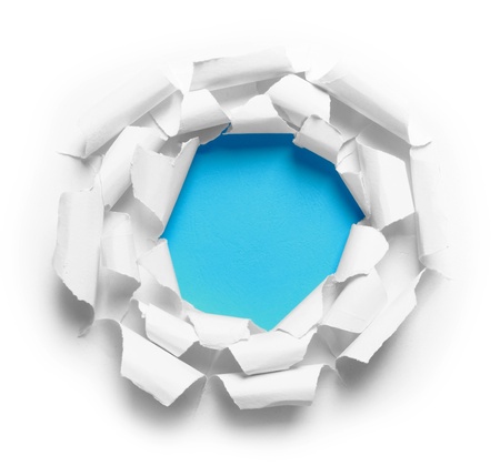 Hole ripped in three white paper on blue backgroundの写真素材
