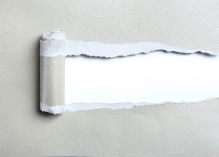 ripped light gray paper over white backgroundの写真素材