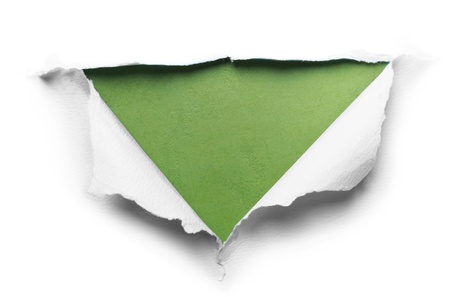 white torn paper with triangle shape over green backgroundの写真素材