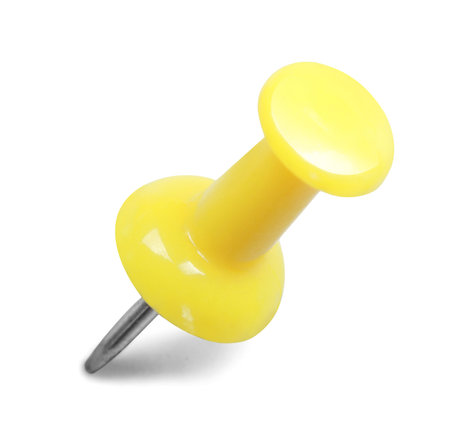 close up of a yellow pushpin isolated on white background