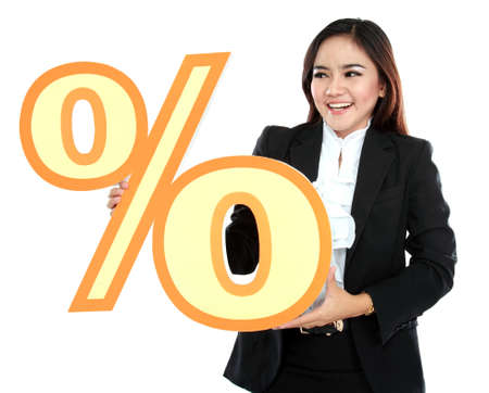 Picture of happy businesswoman holding sign of percent isolated on white backgroundの写真素材