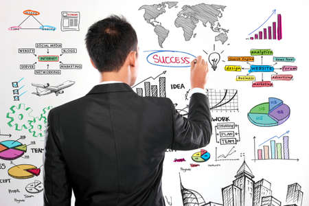 Businessman drawing modern business concept on whiteの写真素材