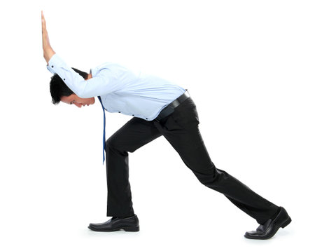 Young businessman pushing a blank board on white backgroundの写真素材