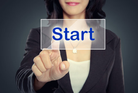 portrait of Businessman push to  Act Now button on virtual screenの写真素材