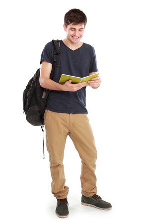 portrait of Young happy student carrying bags and booksの写真素材
