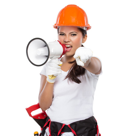 portrait of Female Construction Worker With Toolbelt hold a megaphoneの写真素材