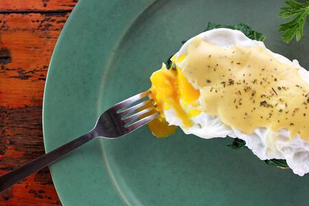 portrait of melted egg benedictの写真素材