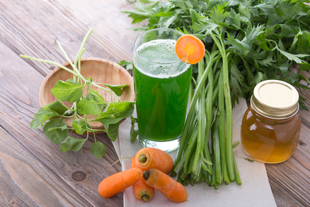 A potrait of mix juice of carrot and spinachの写真素材