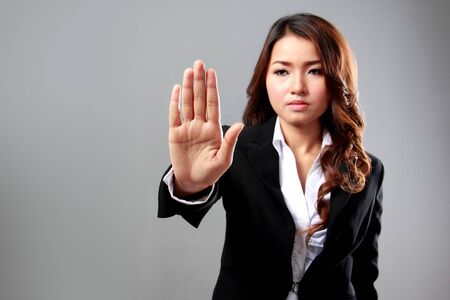 A portrait of a young businesswoman push a virtual screen, conceptの写真素材