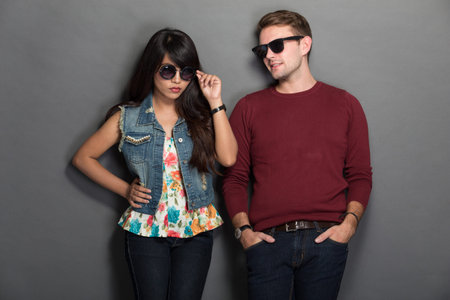 A portrait of a happy young multicultural couple chic pose