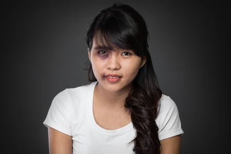 A portrait of a asian woman victim of domestic abuseの写真素材