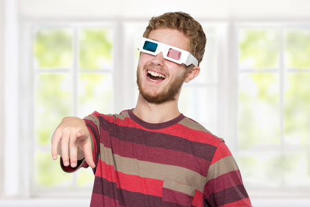 happy man with 3d movie glasses celebrating new movie