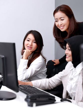 portrait of a group of happy businesswomen in a meeting at officeの写真素材