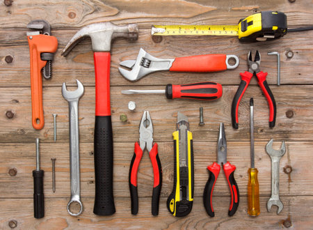A portrait of a mechanical kit in wooden background. construction tool