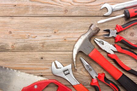 A portrait of a mechanical kit in wooden background. construction tool with a copy spaceの写真素材