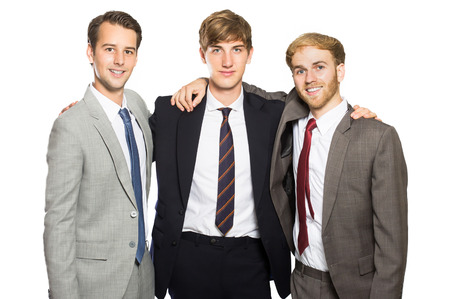porrtait of three businessmen smiling and embrace each other isolated in whiteの写真素材
