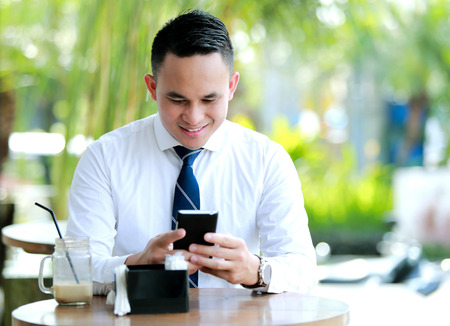 young businessman enjoy texting on leisure timeの写真素材