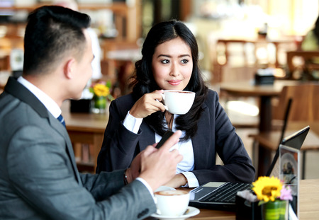 portrait of business couple having a coffee breakの写真素材