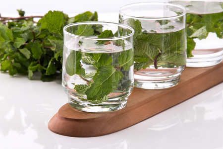 Summer fresh fruit Flavored infused water mix of spearmint isolated over white backgroundの写真素材