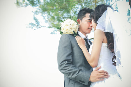 romantic newlywed couple in sunny day with copy spaceの写真素材