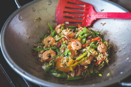 A portrait of asian cuisine, sauteing prawn, bean and vegetablesの写真素材