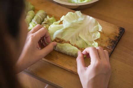 A portrait of processing to make a meat wrap in cabbage. cabbage roll recipeの写真素材