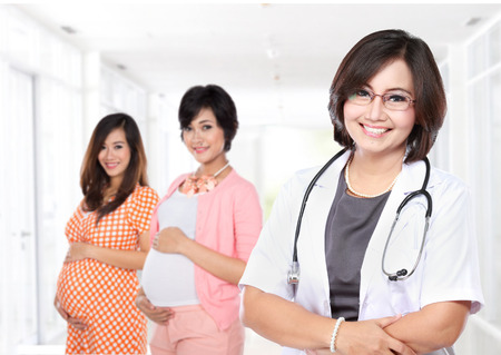 portrait of Smiling obstretricians with stethoscope with her patientの写真素材