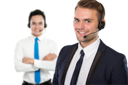A portrait of a pair of Employee of call center with a headset on